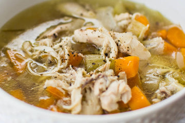 A bowl of warming chicken and vegetable soup