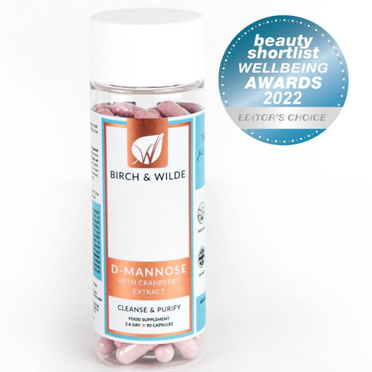  product pack shot from front of Birch & Wilde D-Mannose with cranberry extract capsules in a bottle with a plain background