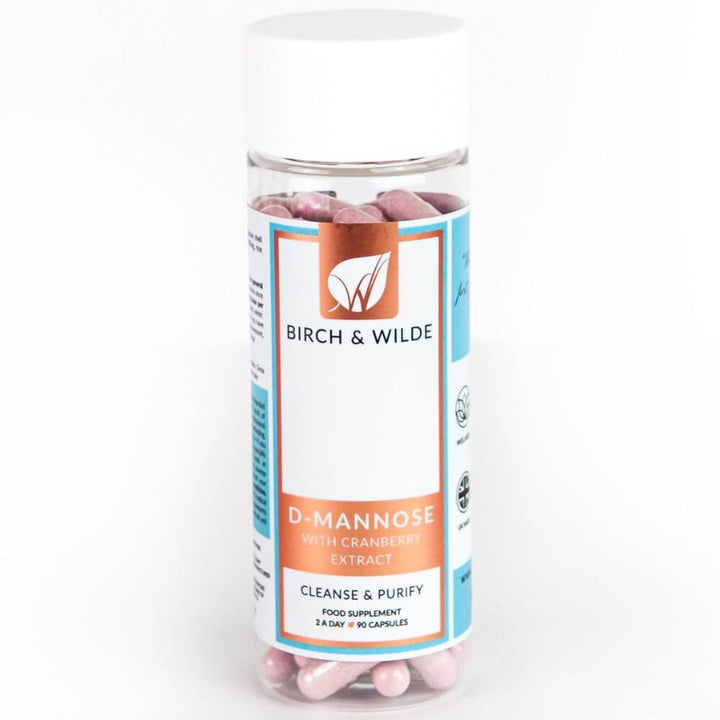  product pack shot from front of Birch & Wilde D-Mannose with cranberry extract capsules in a bottle with a plain background