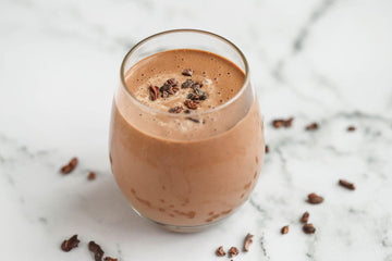 Image of a mocha chocolate coffee and medjool date wake up breakfast smoothie served in a clear glass