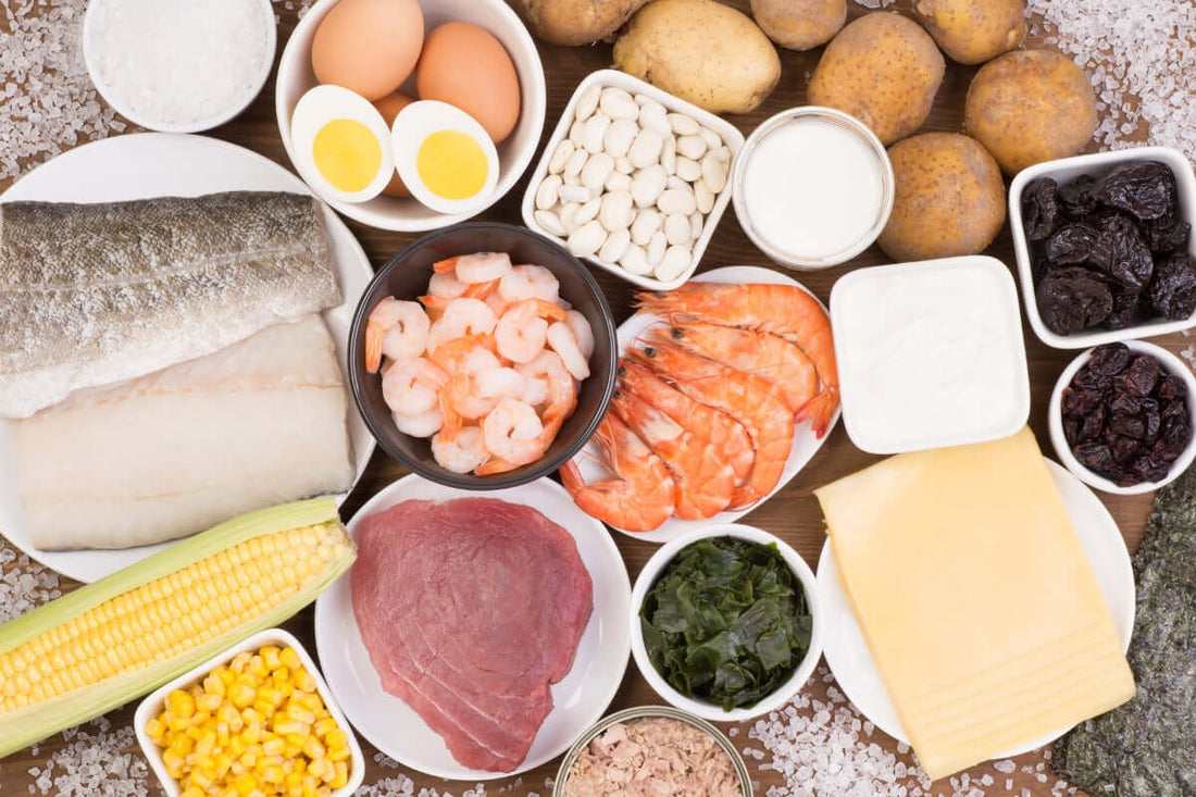 Image showing best food sources of iodine including eggs, tuna, cheese and dairy, fish and prawns all laid out together and viewed from above
