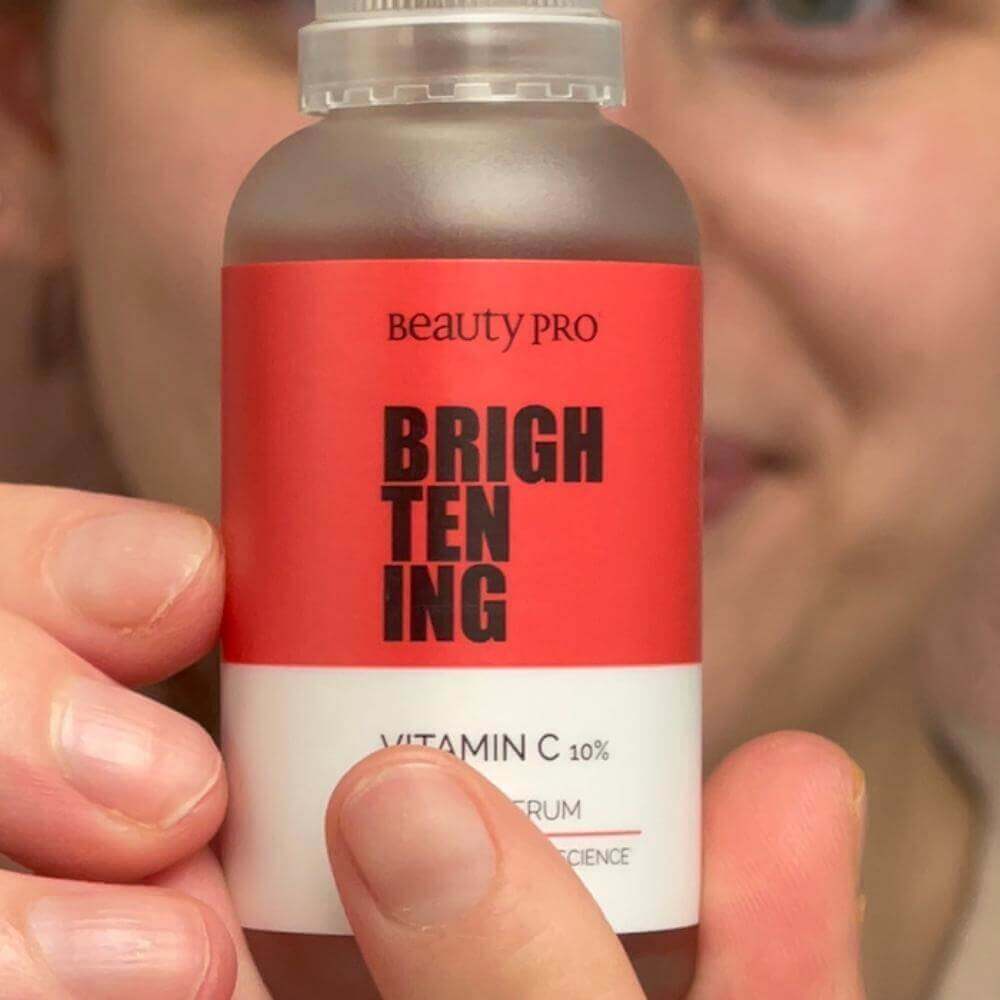 close up product shot of the from of a beauty pro brightening daily serum bottle
